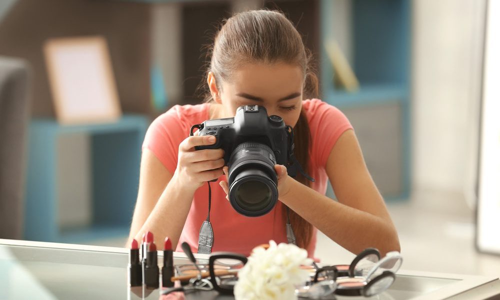 Woman taking camera shots on products